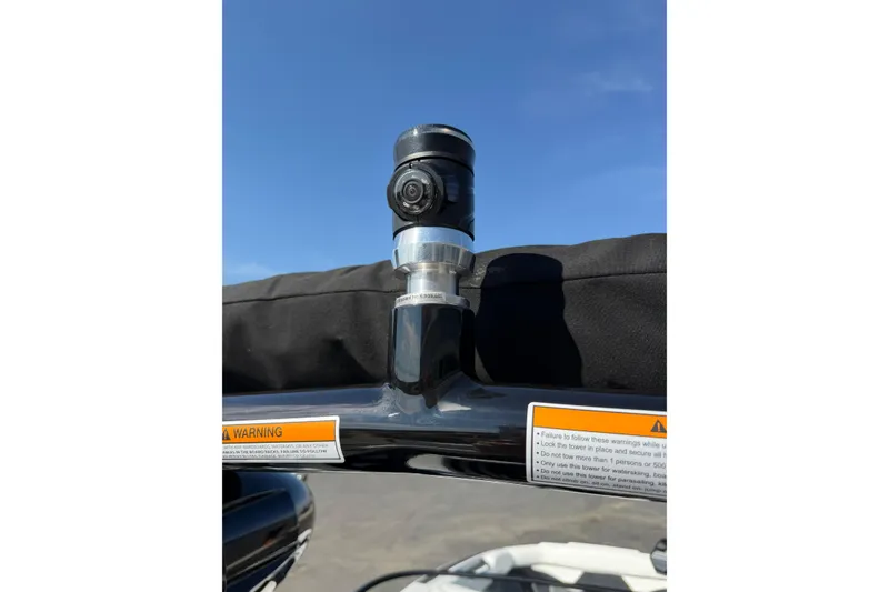 Slide: The Image of 2025 Moomba Makai boat tower with mounted camera under clear blue sky. - 18