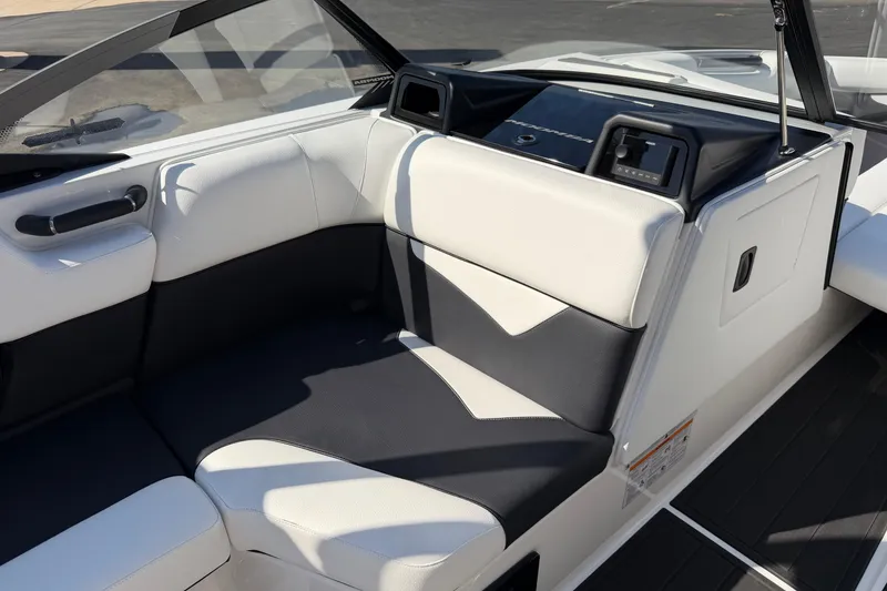 Slide: The Image of 2025 Moomba Makai boat interior with sleek black and white seating design. - 23