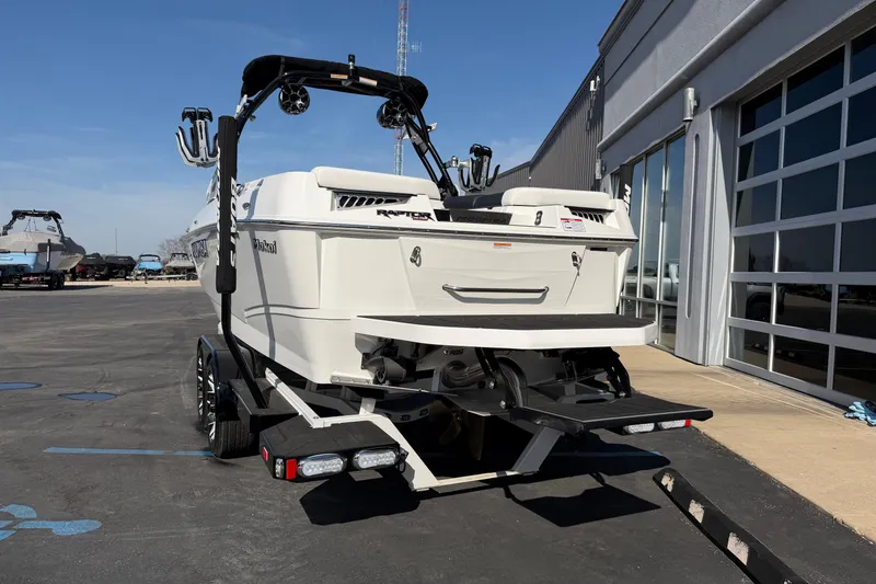 Slide: The Image of 2025 Moomba Makai boat on trailer, parked outside a building. - 3