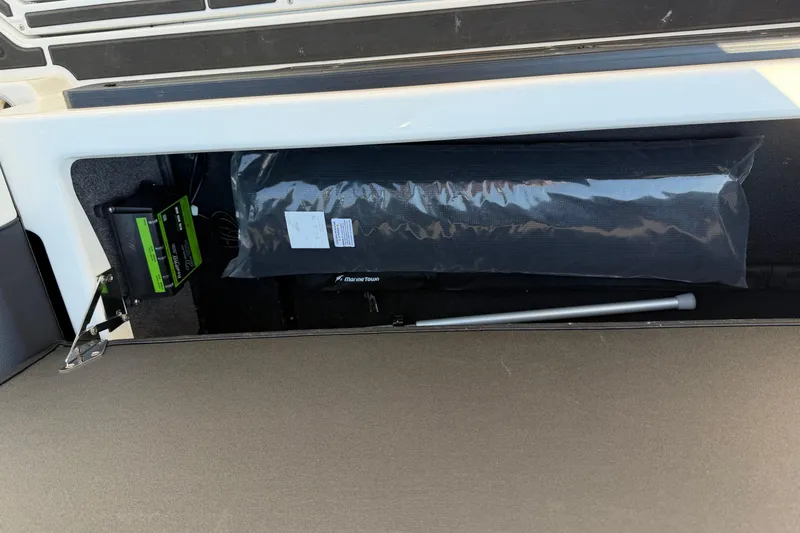 Slide: The Image of 2025 Moomba Makai storage compartment with equipment and accessories. - 32