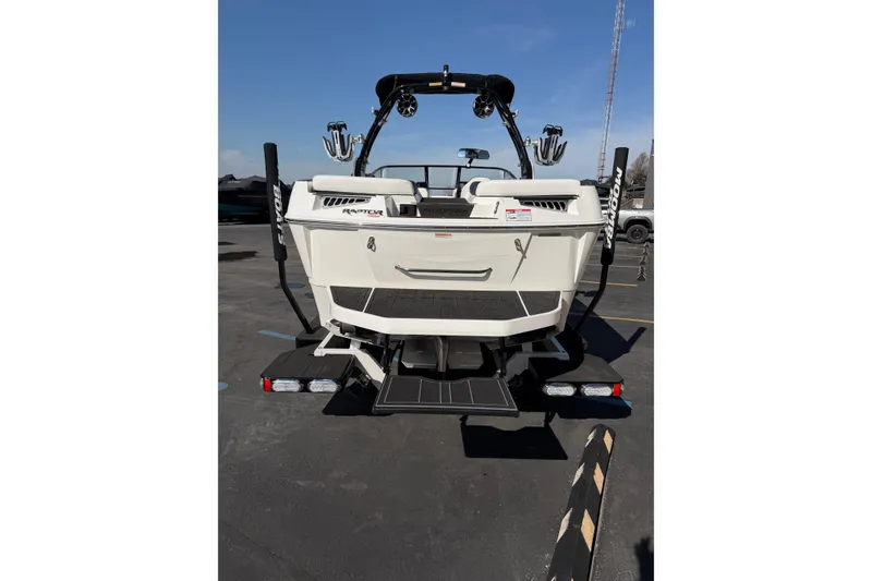 Slide: The Image of 2025 Moomba Makai boat rear view with swim platform and tower accessories. - 4