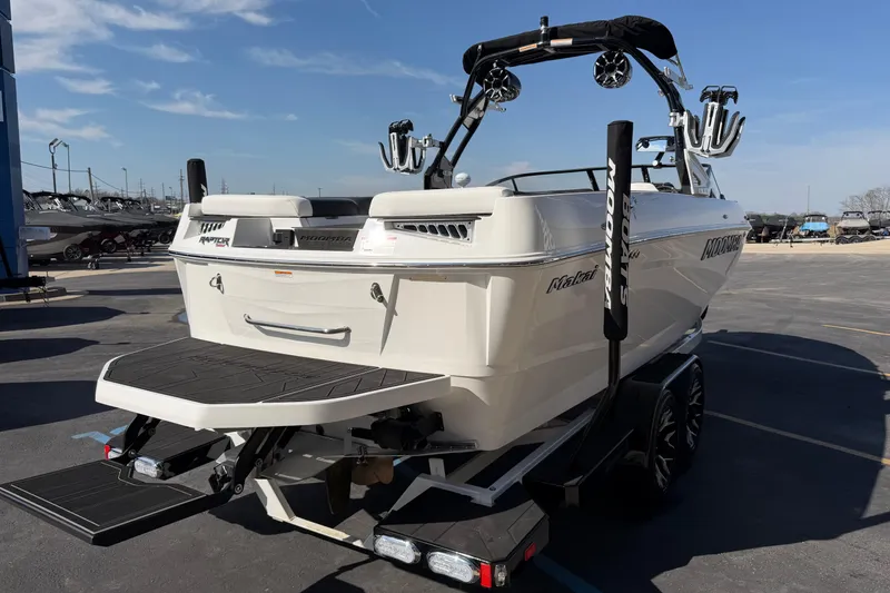 Slide: The Image of 2025 Moomba Makai boat on trailer, rear view, showcasing sleek design and features. - 5