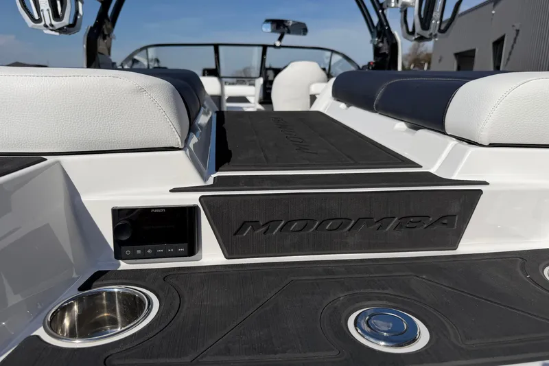 Slide: The Image of 2025 Moomba Makai boat interior with sleek seating and audio system. - 8