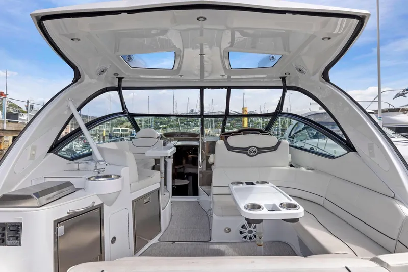 Slide: The Image of Luxurious 2019 Cruisers Yachts 38 Express interior with sleek seating and modern amenities. - 20