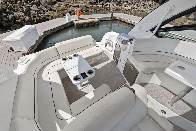 Slide: The Image of Luxurious 2019 Cruisers Yachts 38 Express interior with elegant seating and modern amenities. - 22