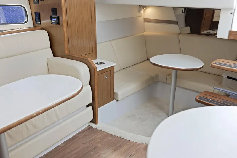 Slide: The Image of Luxurious interior of 2019 Cruisers Yachts 38 Express with elegant seating and tables. - 41