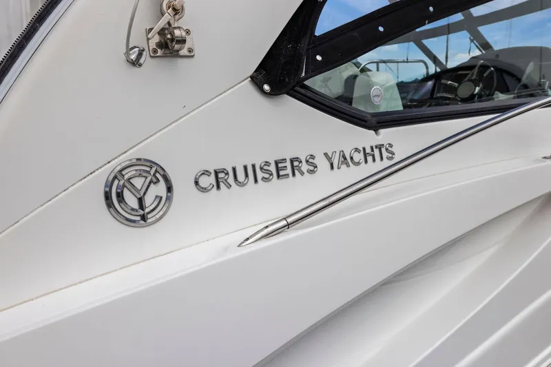 Slide: The Image of 2019 Cruisers Yachts 38 Express logo on white yacht exterior. - 44