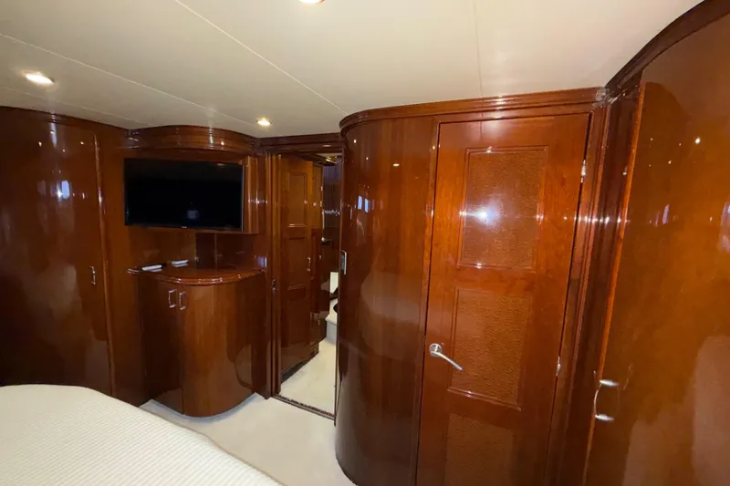 Slide: The Image of Luxurious wood-paneled interior of a 2004 Marquis 59 yacht with modern amenities. - 38