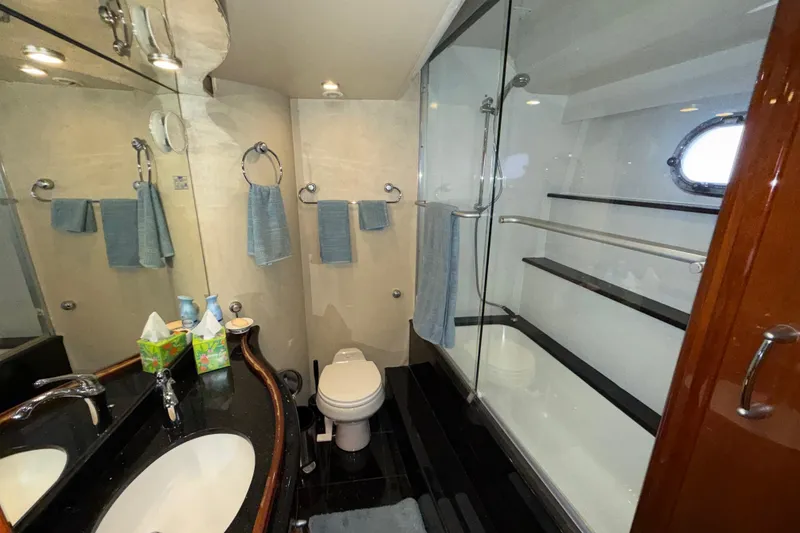 Slide: The Image of Luxurious 2004 Marquis 59 yacht bathroom with modern fixtures and elegant design. - 39