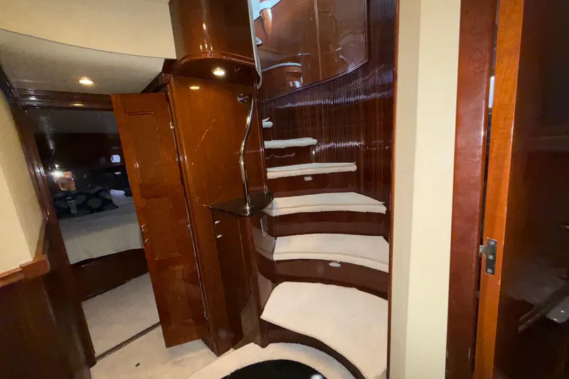 Slide: The Image of Luxurious interior of a 2004 Marquis 59 yacht with elegant wooden staircase. - 41