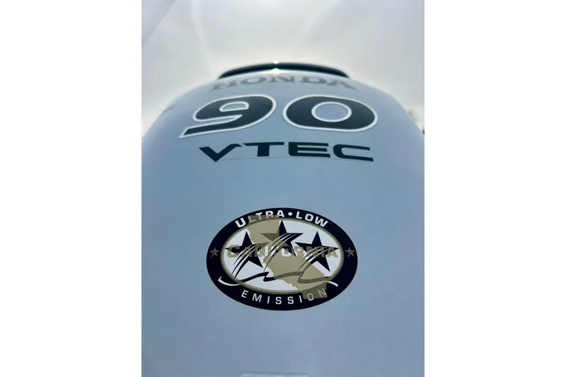 Slide: The Image of Honda VTEC 90 outboard motor with ultra-low emission sticker on Alumacraft Classic 165 Sport, 2021. - 14