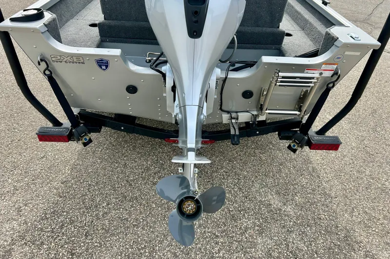 Slide: The Image of Rear view of 2021 Alumacraft Classic 165 Sport boat with motor and trailer. - 15