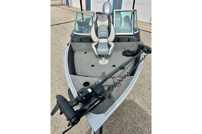 Slide: The Image of 2021 Alumacraft Classic 165 Sport boat with trolling motor and seating. - 16