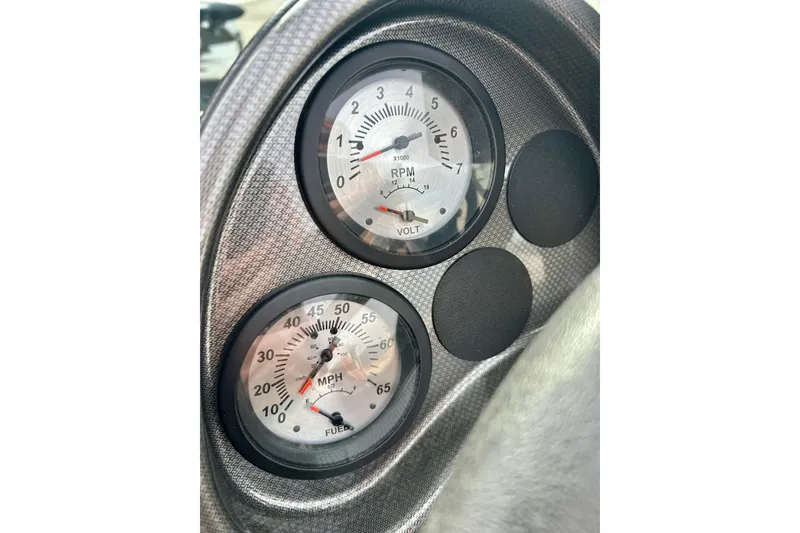 Slide: The Image of Dashboard gauges of a 2021 Alumacraft Classic 165 Sport boat. - 33