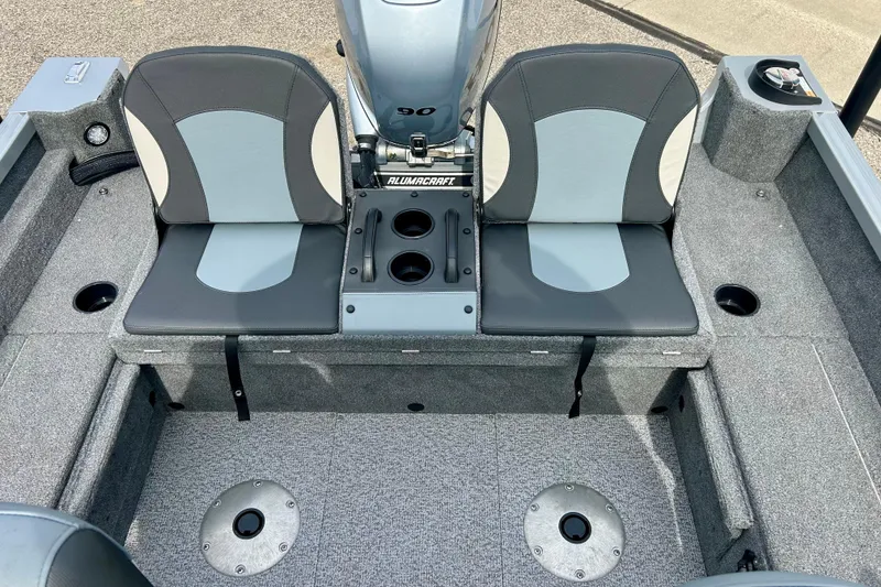 Slide: The Image of 2021 Alumacraft Classic 165 Sport boat interior with dual seats and motor. - 40