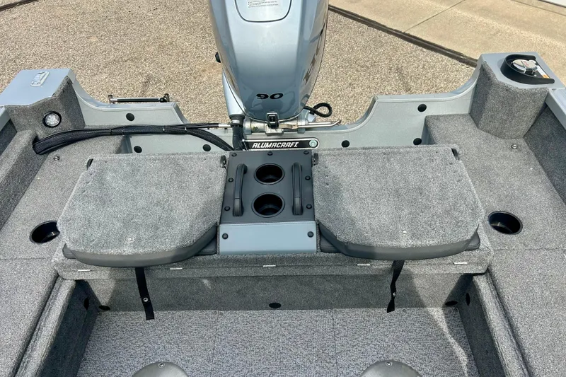Slide: The Image of 2021 Alumacraft Classic 165 Sport boat interior with motor and seating area. - 41