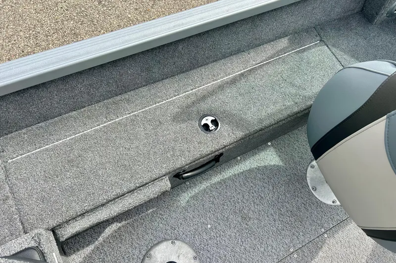 Slide: The Image of 2021 Alumacraft Classic 165 Sport boat interior with gray carpet and seating. - 43