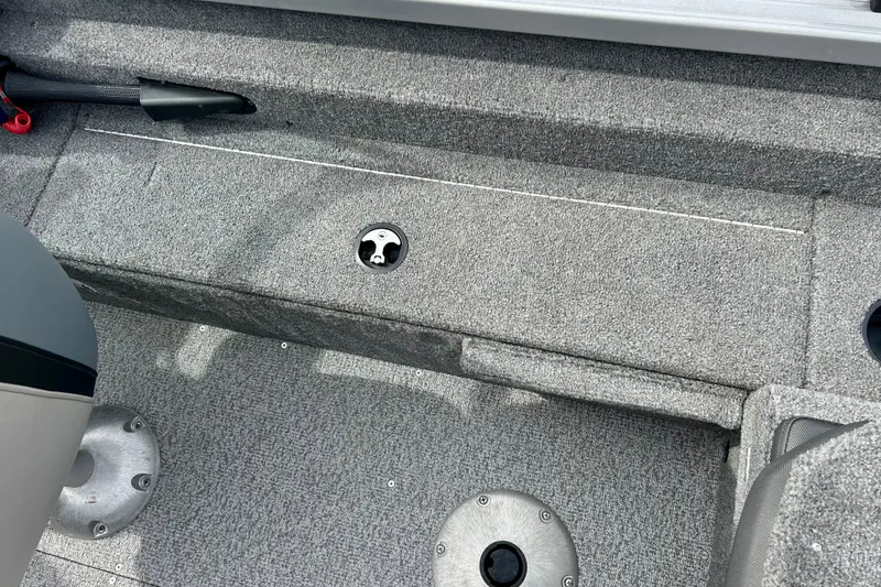 Slide: The Image of 2021 Alumacraft Classic 165 Sport boat interior with gray carpeted flooring. - 45