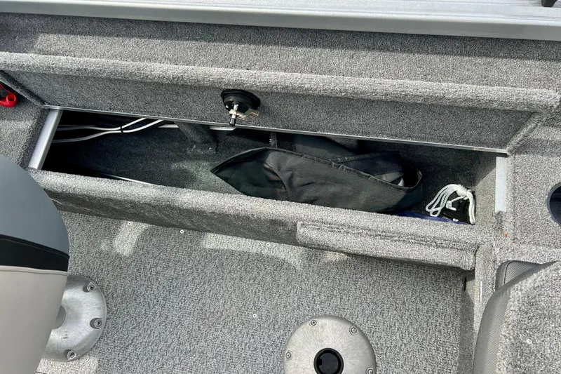 Slide: The Image of Storage compartment in 2021 Alumacraft Classic 165 Sport boat interior. - 46