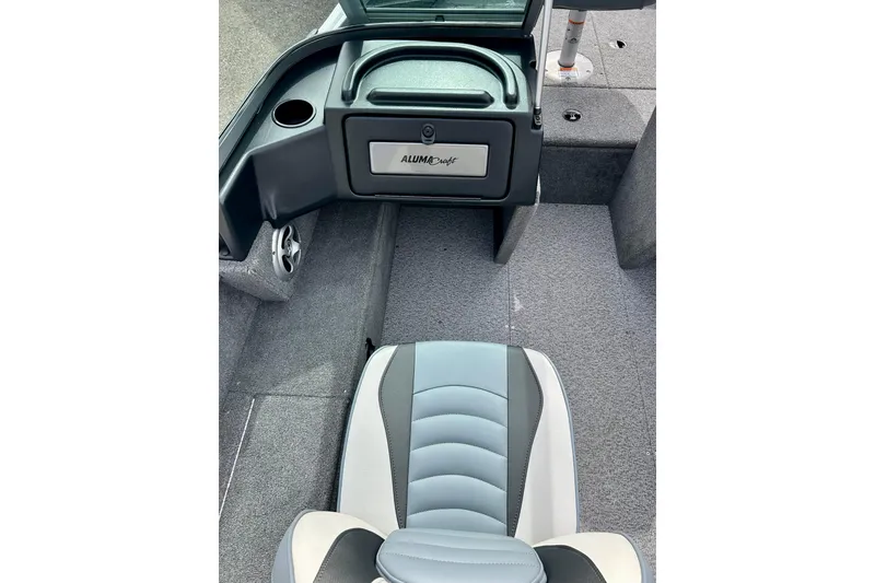 Slide: The Image of 2021 Alumacraft Classic 165 Sport boat interior with seating and storage compartment. - 47