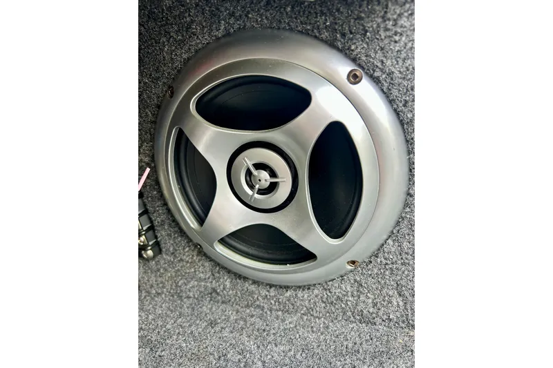 Slide: The Image of Speaker installed in 2021 Alumacraft Classic 165 Sport boat, mounted on carpeted surface. - 53