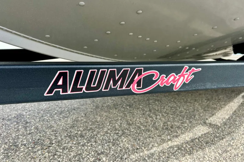Slide: The Image of Alumacraft Classic 165 Sport 2021 logo on boat trailer frame. - 57