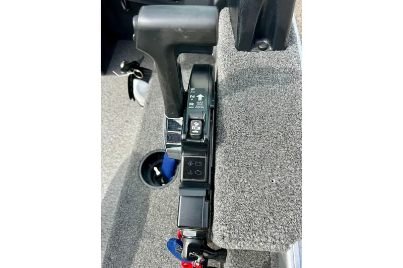 Slide: The Image of Close-up of 2021 Alumacraft Classic 165 Sport boat throttle control. - 66