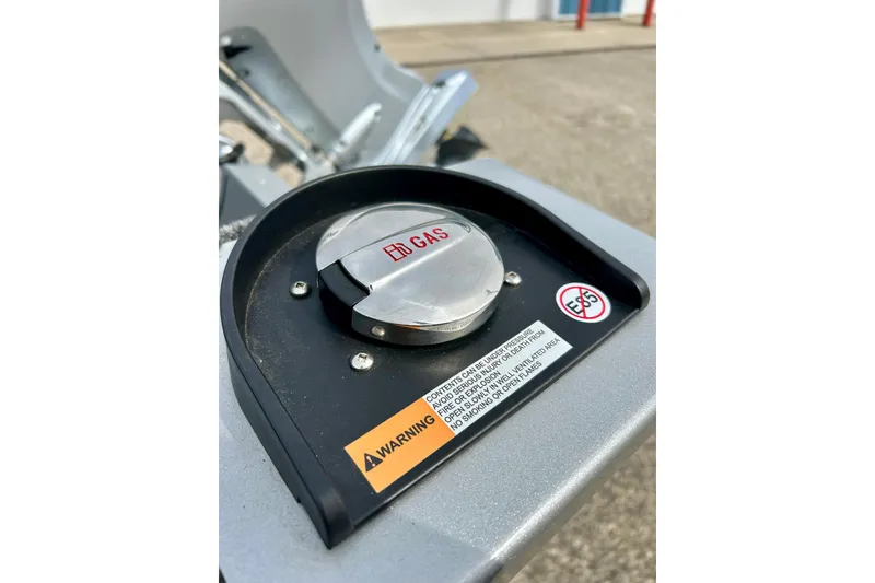 Slide: The Image of Fuel cap of 2021 Alumacraft Classic 165 Sport boat with warning labels. - 69