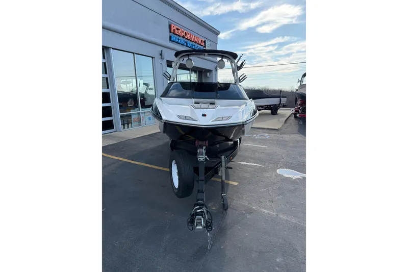 Slide: The Image of 2014 Moomba Mondo boat on trailer outside Performance Marine dealership. - 10