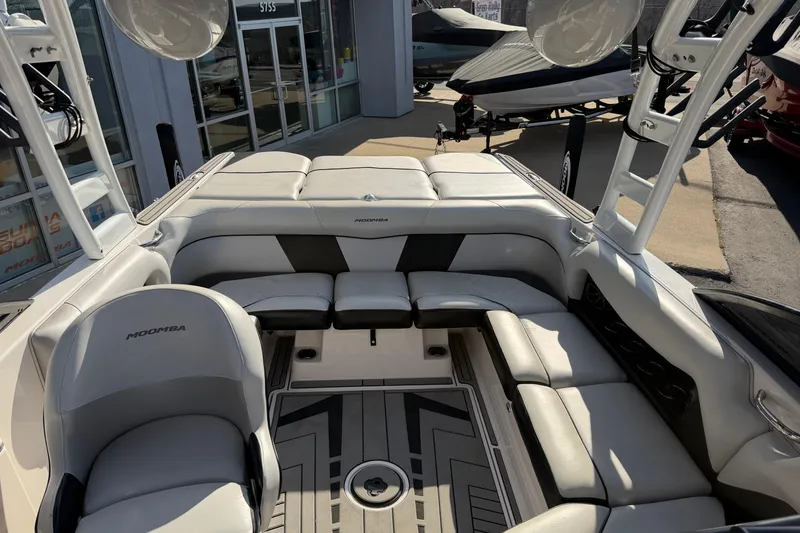 Slide: The Image of 2014 Moomba Mondo boat interior with sleek seating and modern design. - 12