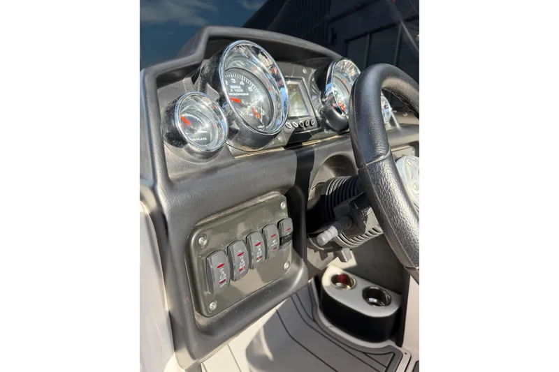 Slide: The Image of Dashboard of a 2014 Moomba Mondo boat with gauges and controls. - 15