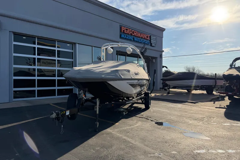 Slide: The Image of 2014 Moomba Mondo boat on trailer at Performance Marine Watersports dealership. - 17