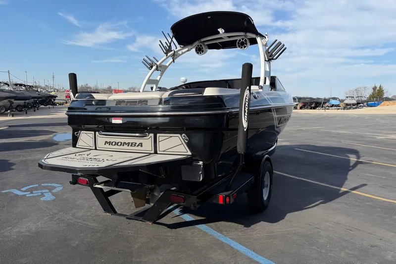 Slide: The Image of 2014 Moomba Mondo boat on trailer in parking lot, rear view. - 7
