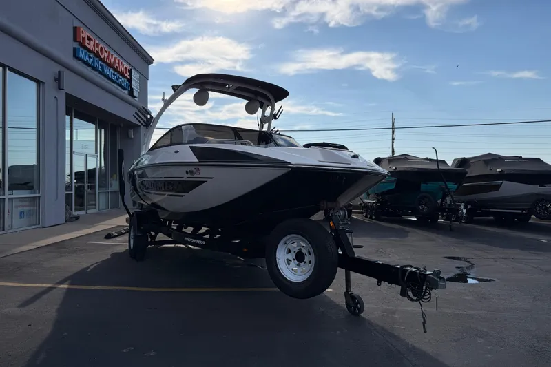 Slide: The Image of 2014 Moomba Mondo boat on trailer at Performance Marine Watersports dealership. - 9