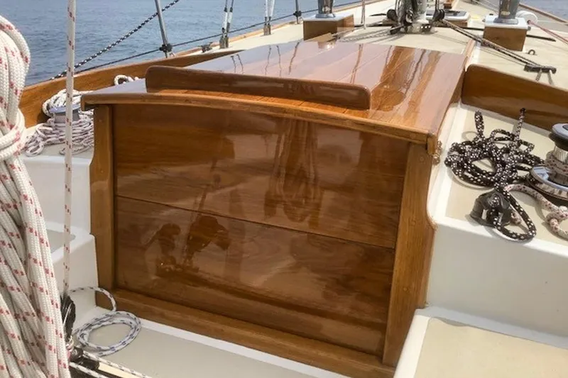 Slide: The Image of Polished wooden deck of 1988 Morris Frances 26 sailboat with ropes and winches. - 14