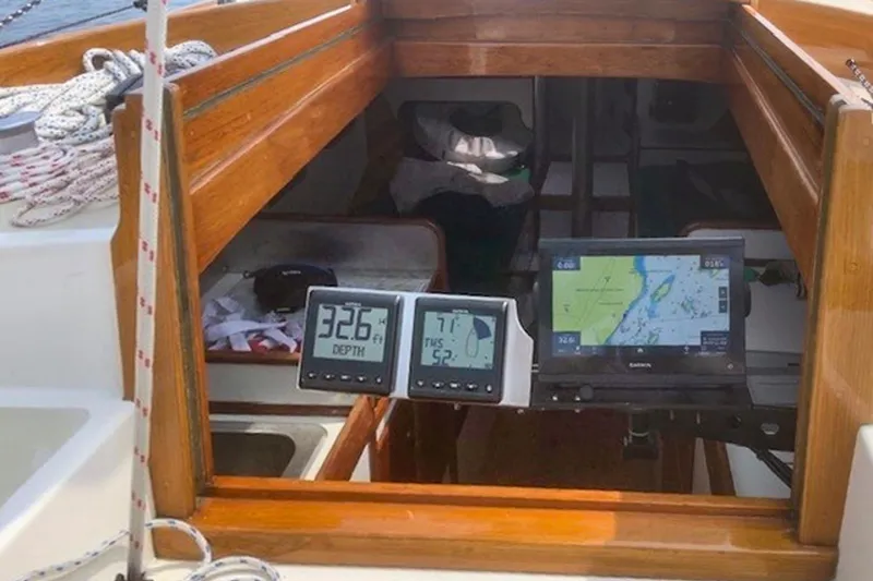 Slide: The Image of Interior of 1988 Morris Frances 26 sailboat with navigation instruments and wooden finish. - 15