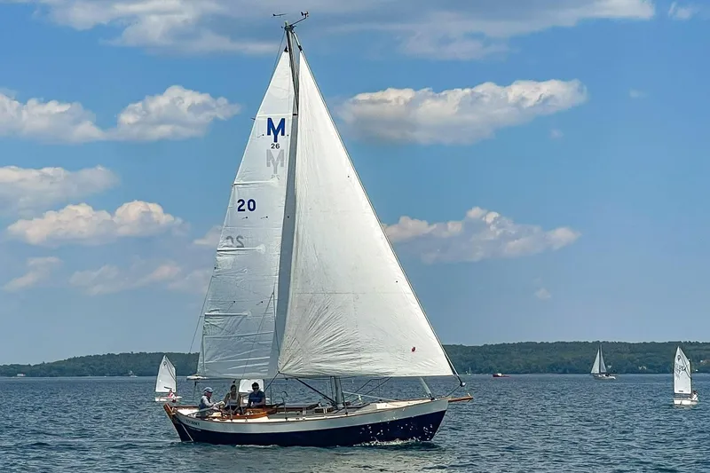 Slide: The Image of Sailboat Morris Frances 26 (1988) cruising on a sunny lake with blue skies. - 2
