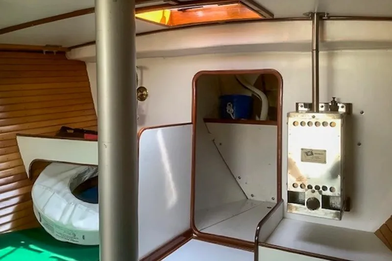 Slide: The Image of Interior of 1988 Morris Frances 26 sailboat with wooden paneling and equipment. - 21