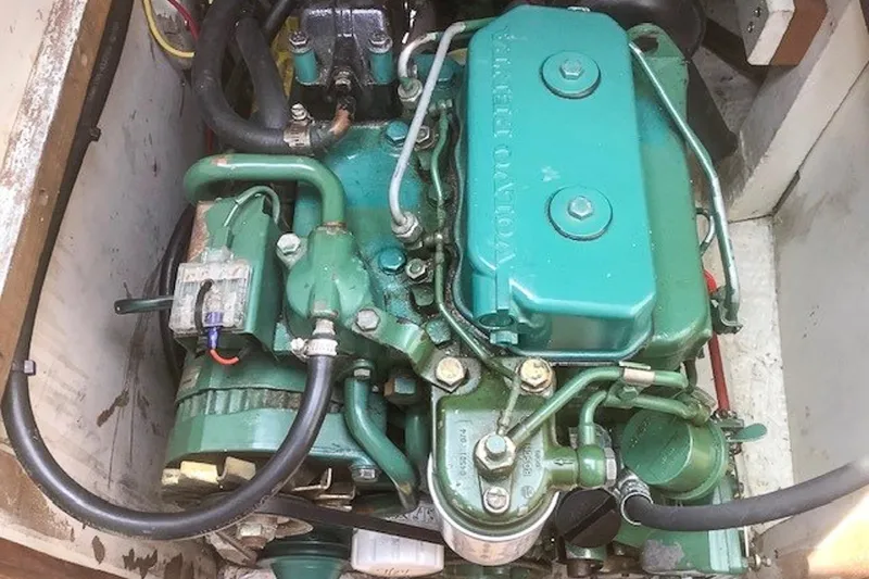 Slide: The Image of Engine of a 1988 Morris Frances 26 boat, featuring green components and visible wiring. - 27
