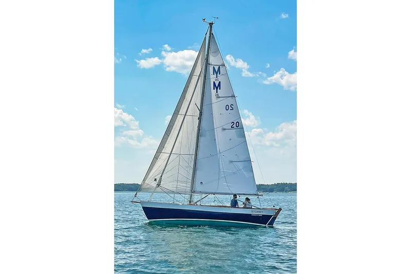Slide: The Image of Sailing on a Morris Frances 26 yacht, 1988 model, under clear blue skies. - 28