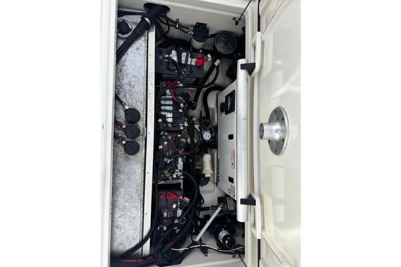 Slide: The Image of Engine compartment of a 2016 Boston Whaler 315 Conquest boat, showcasing detailed components. - 14
