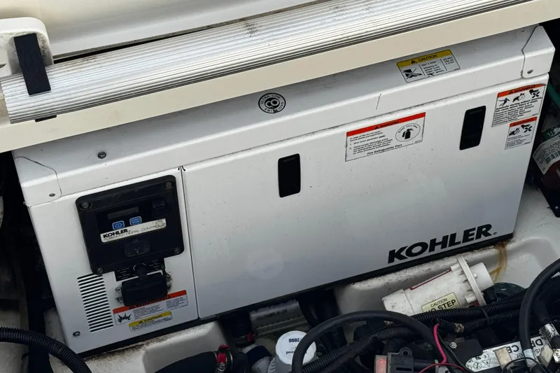 Slide: The Image of Kohler generator in a 2016 Boston Whaler 315 Conquest boat engine compartment. - 15