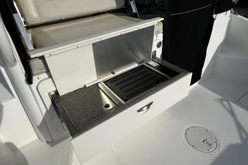 Slide: The Image of Outdoor grill and sink on a 2016 Boston Whaler 315 Conquest boat. - 22