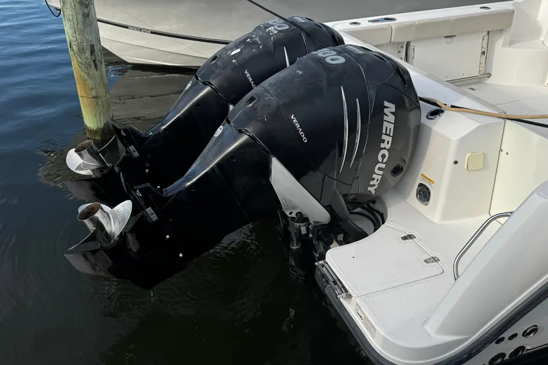 Slide: The Image of 2016 Boston Whaler 315 Conquest with twin Mercury Verado outboard engines docked. - 31