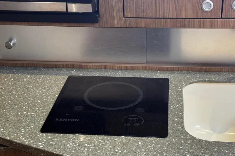 Slide: The Image of Kenyon cooktop on 2016 Boston Whaler 315 Conquest kitchen counter. - 40