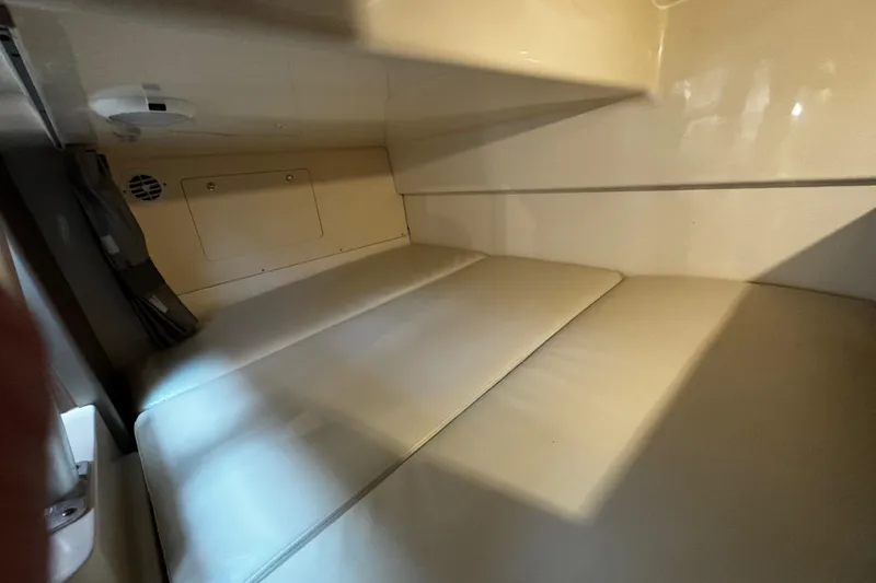 Slide: The Image of Interior cabin of 2016 Boston Whaler 315 Conquest with cushioned seating. - 45