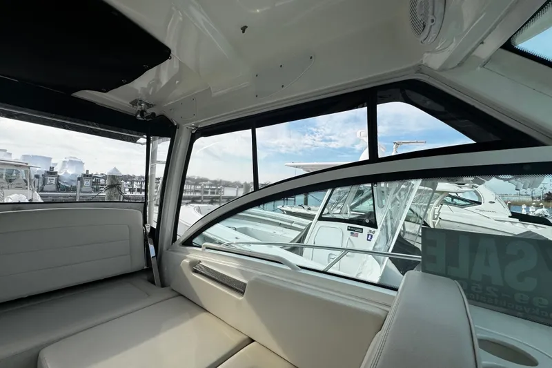 Slide: The Image of Interior view of a 2016 Boston Whaler 315 Conquest boat at a marina. - 57