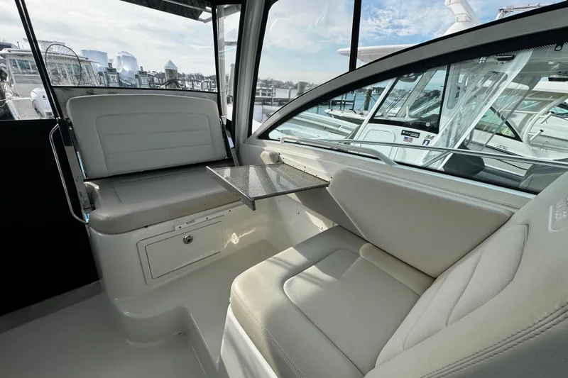 Slide: The Image of Interior of 2016 Boston Whaler 315 Conquest boat, featuring comfortable seating and sleek design. - 61
