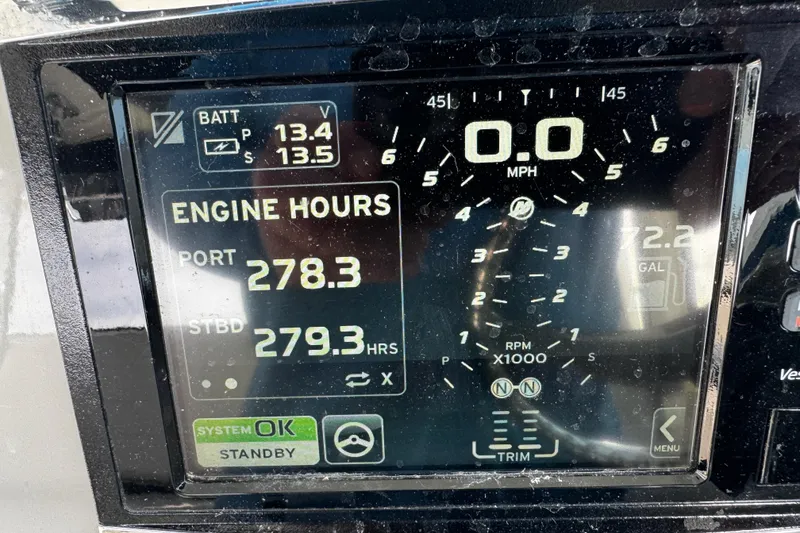 Slide: The Image of Dashboard display of a 2016 Boston Whaler 315 Conquest showing engine hours and battery voltage. - 78