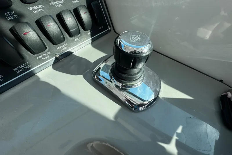 Slide: The Image of Control panel and joystick on a 2016 Boston Whaler 315 Conquest boat. - 80